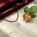 Trishul Pendant with diya and bilva — ritual flat-lay | Salico