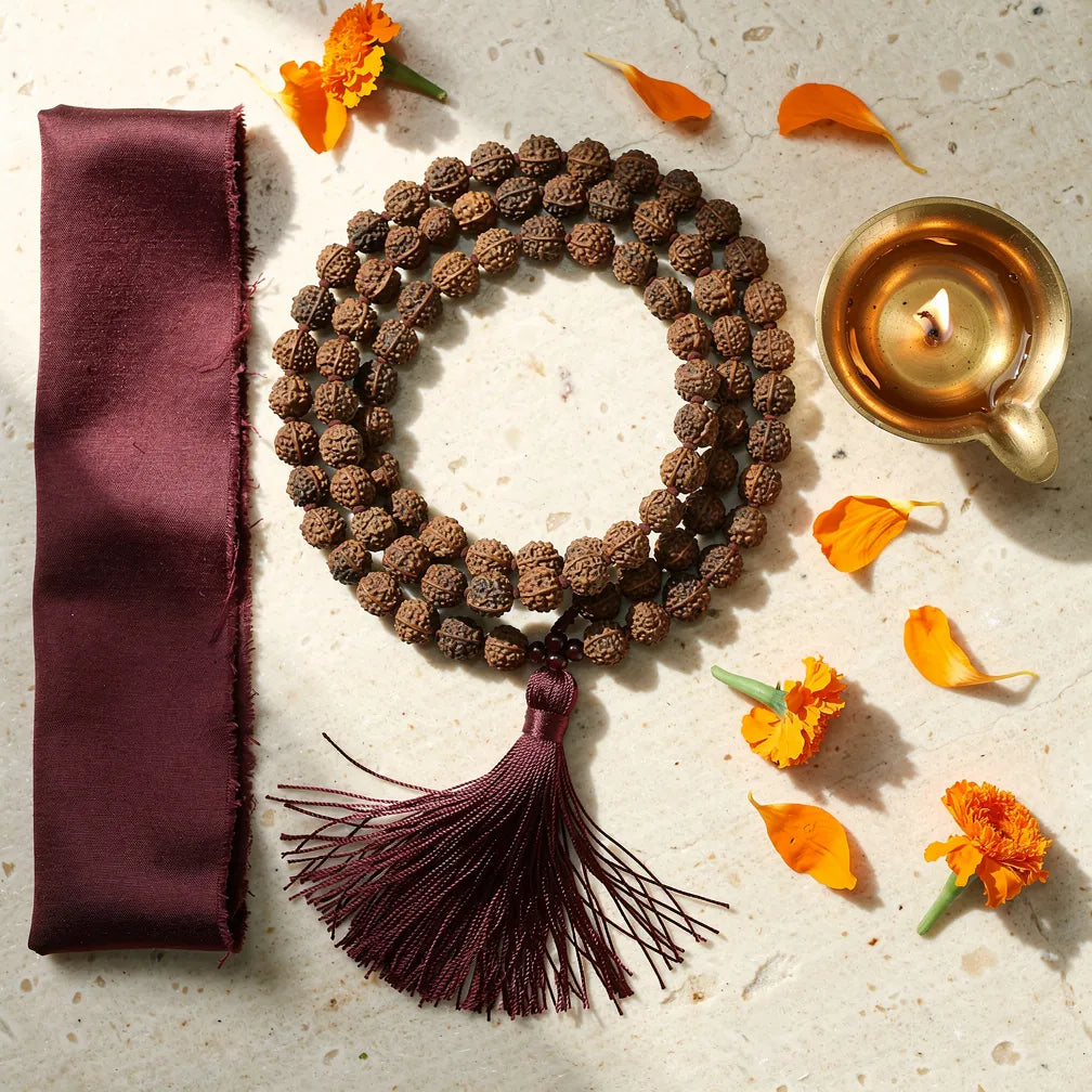 Panch Mukhi Rudraksha Mala with diya and marigold — morning ritual | Salico