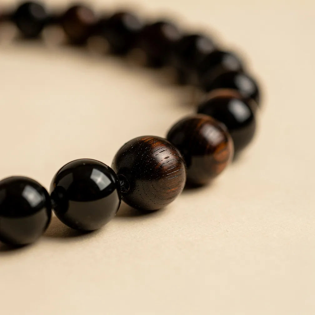 Delicate ebony bead texture close-up | Salico