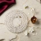 Sphatik Mala with diya and jasmine — ritual flat-lay | Salico
