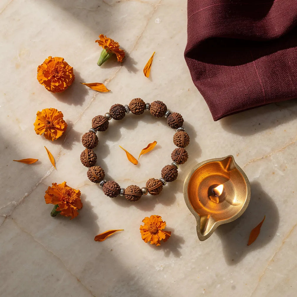 Silver Eclipse Rudraksha Bracelet with diya and marigold — morning ritual | Salico
