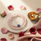 Evil Eye Rose Quartz Band with diya — ritual flat-lay | Salico