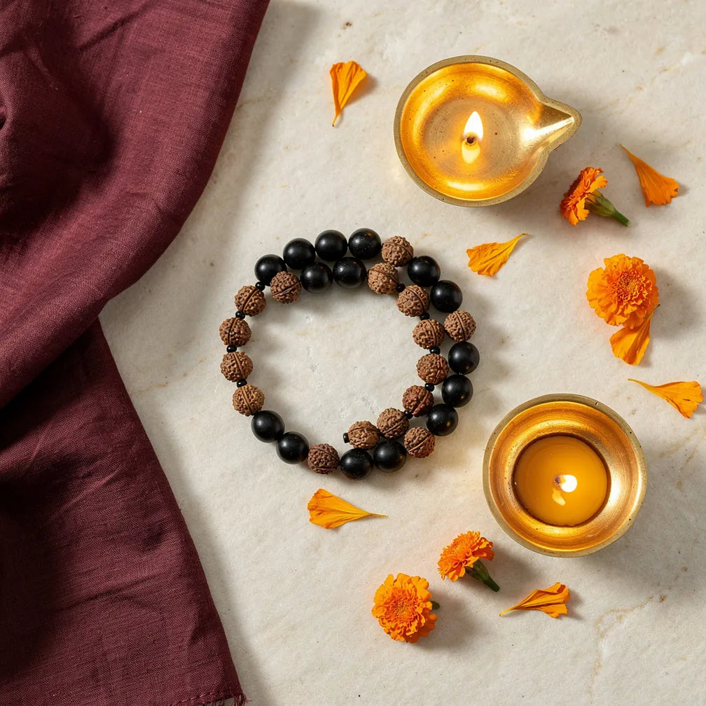 Karungali × Rudraksha Band with diya and marigold — ritual flat-lay | Salico