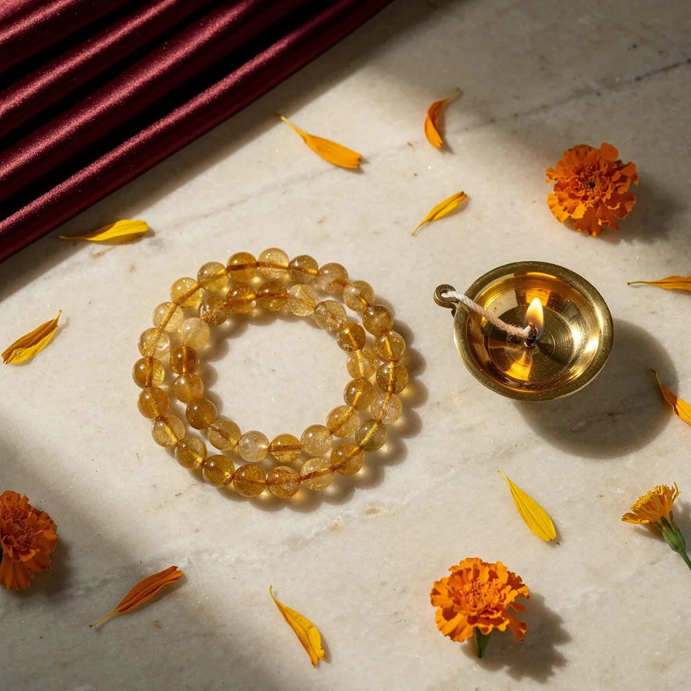 Citrine Band with diya and marigold — ritual flat-lay | Salico