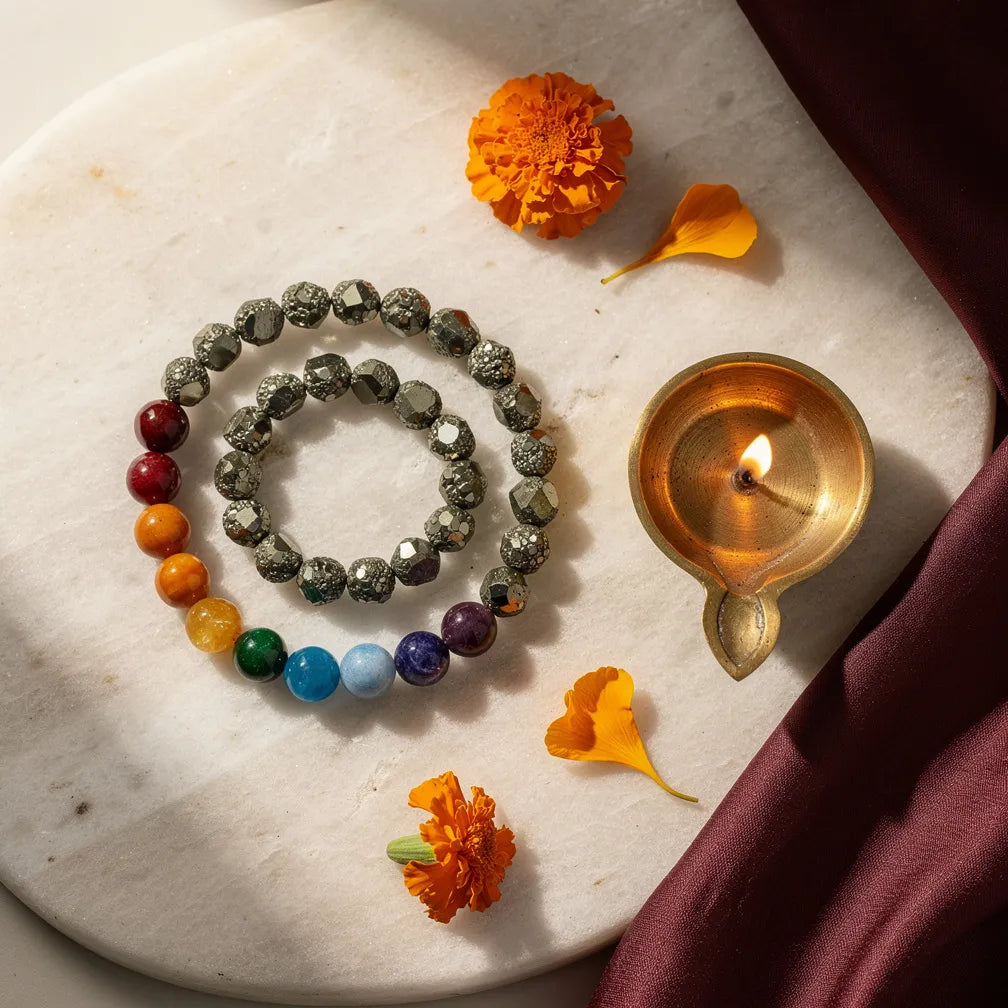 Pyrite Seven Chakra Band with diya — ritual flat-lay | Salico