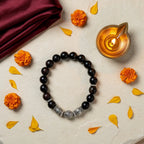 Karungali Silver Kada with diya and marigold — ritual flat-lay | Salico