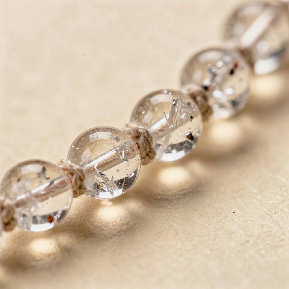 Clear quartz bead and knotting close-up | Salico