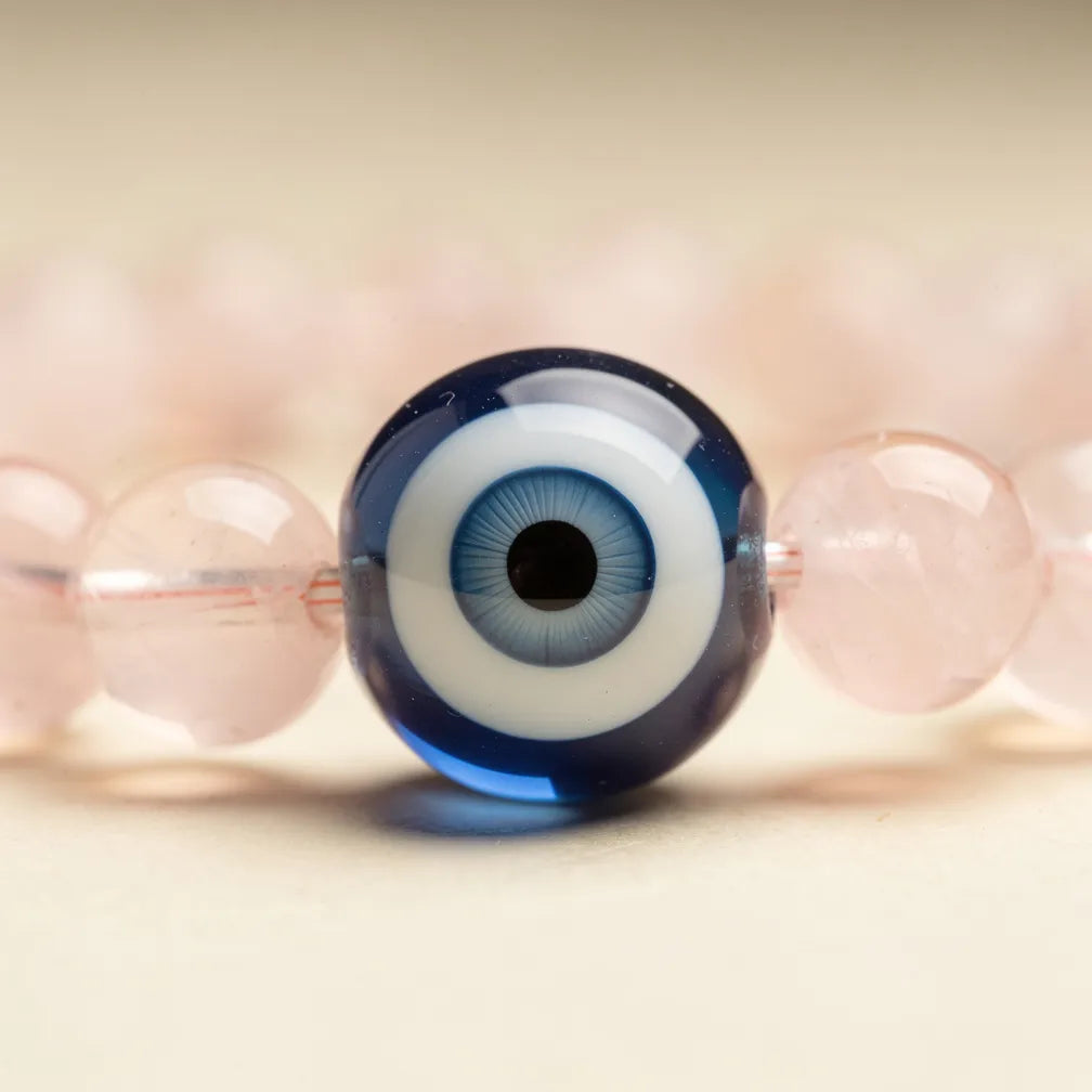 Evil eye charm and rose quartz close-up | Salico