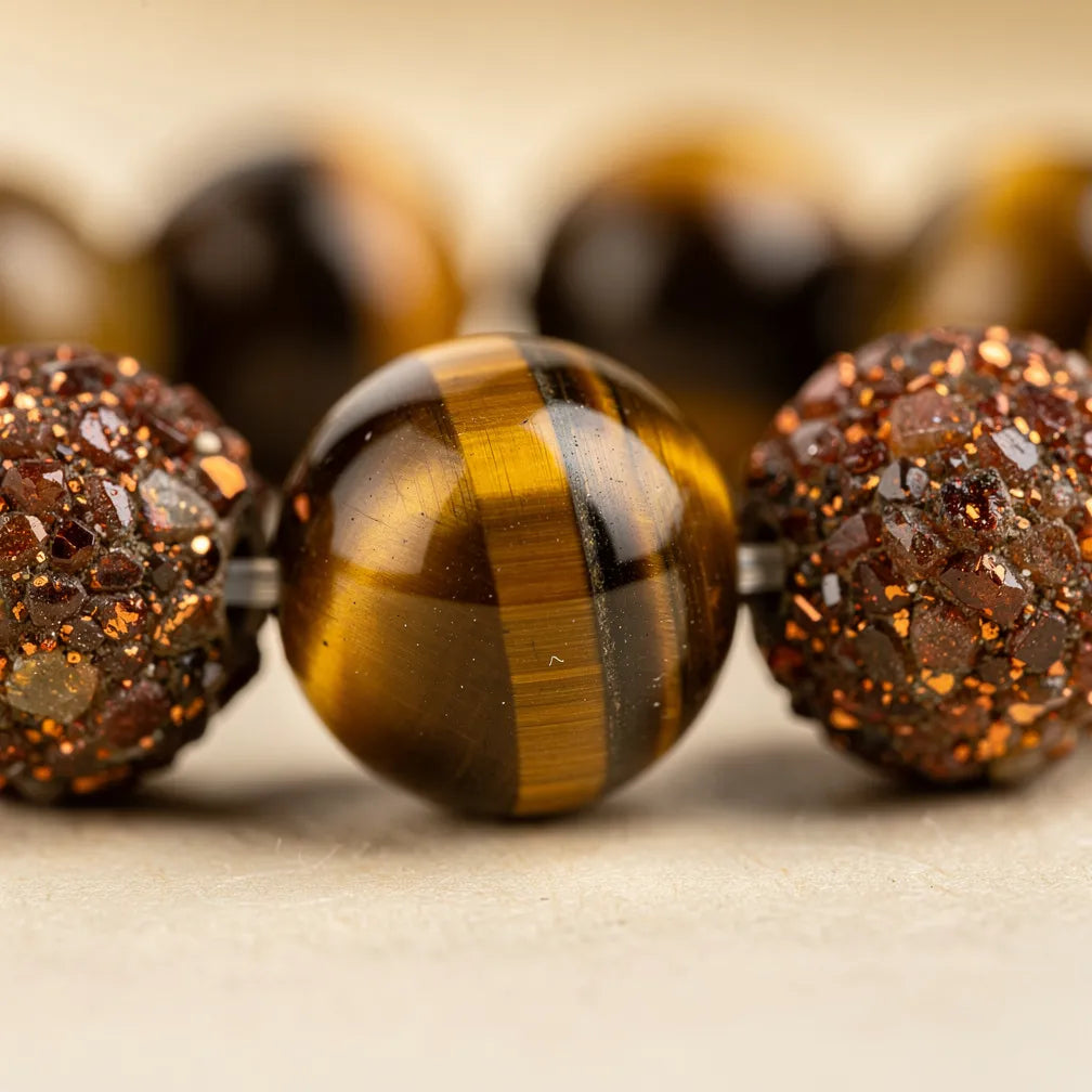 Tiger eye and sunstone texture close-up | Salico