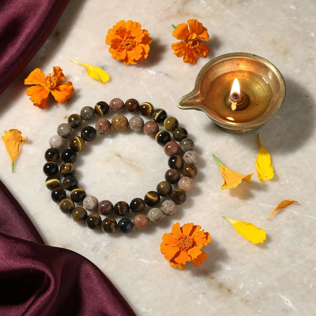 Simha Rashi Band with diya — ritual flat-lay | Salico