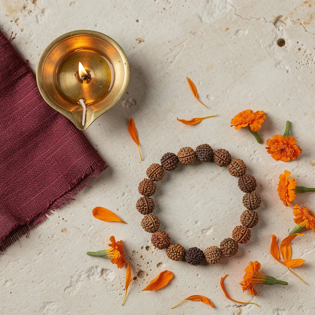 Rudraksha bracelet with diya and marigold — morning ritual | Salico