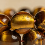 Tiger eye chatoyant band texture close-up | Salico